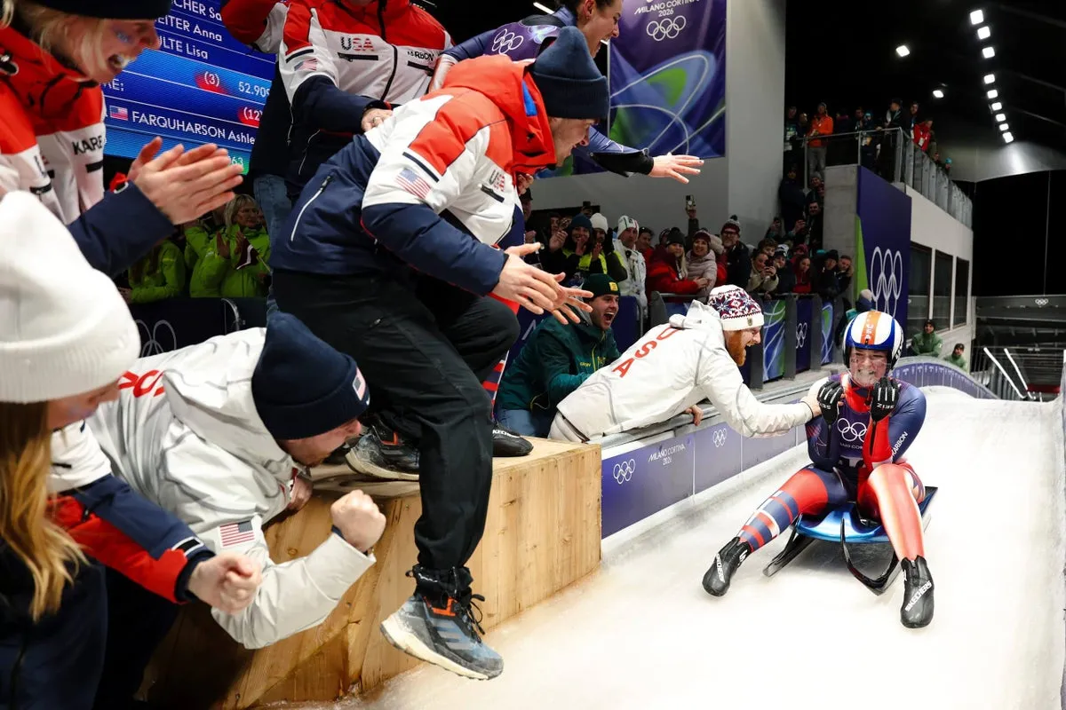 Ashley Farquharson on the podium, smiling proudly after winning the bronze medal in women’s luge.
