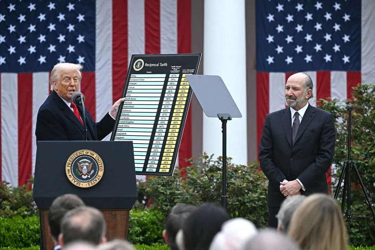 Trump brings Epstein island-tarred Cabinet member Lutnick with him on visit to troops