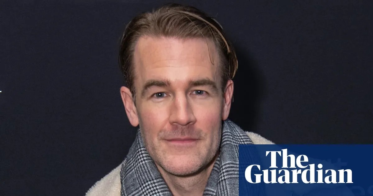 A photo of James Van Der Beek smiling at a public event.