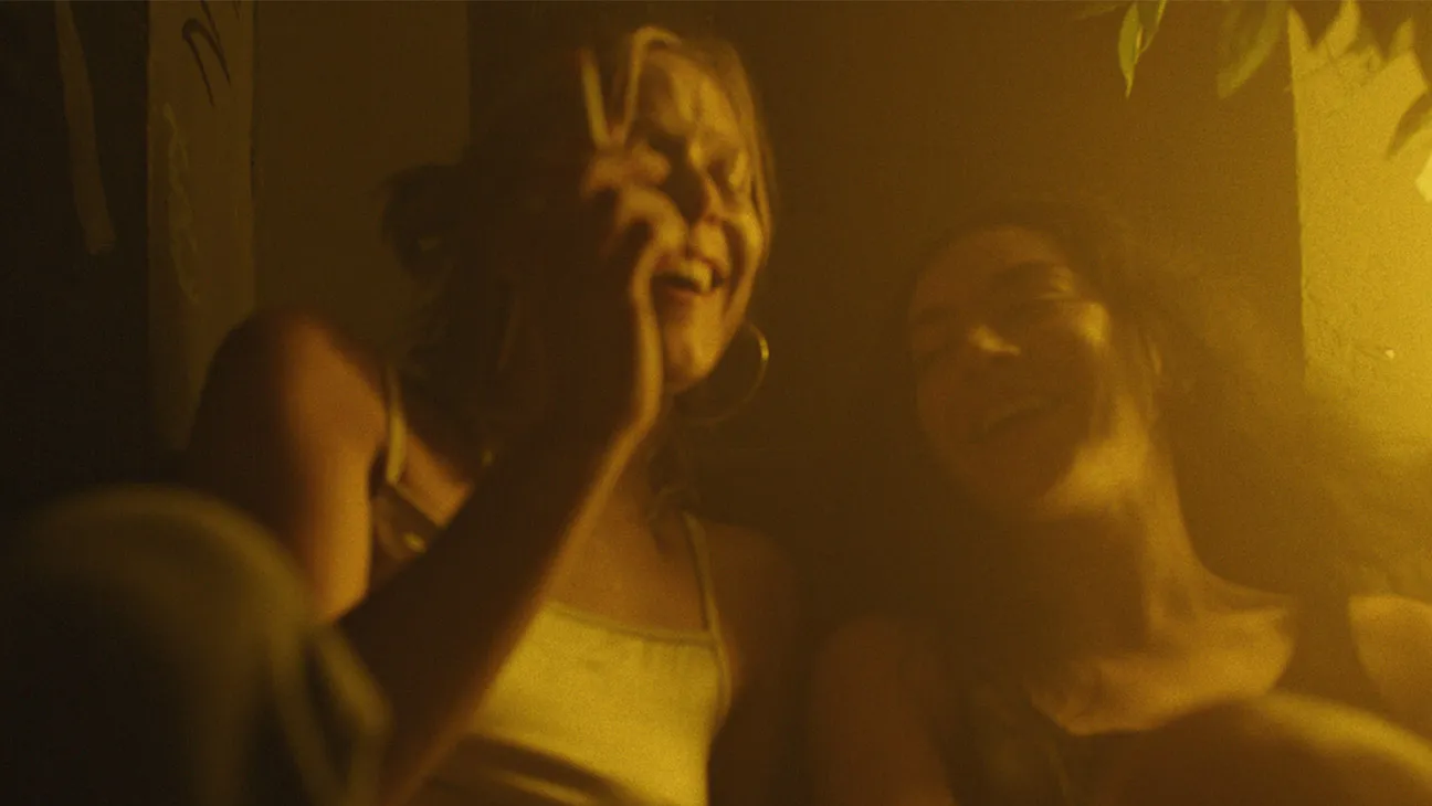 Promotional image for Charli XCX's film 'Erupcja' featuring dramatic visuals from the trailer.