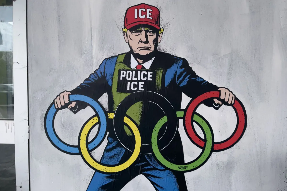 Graffiti of Donald Trump depicted as an ICE agent on a wall in Milan, with an Olympic-themed backdrop.