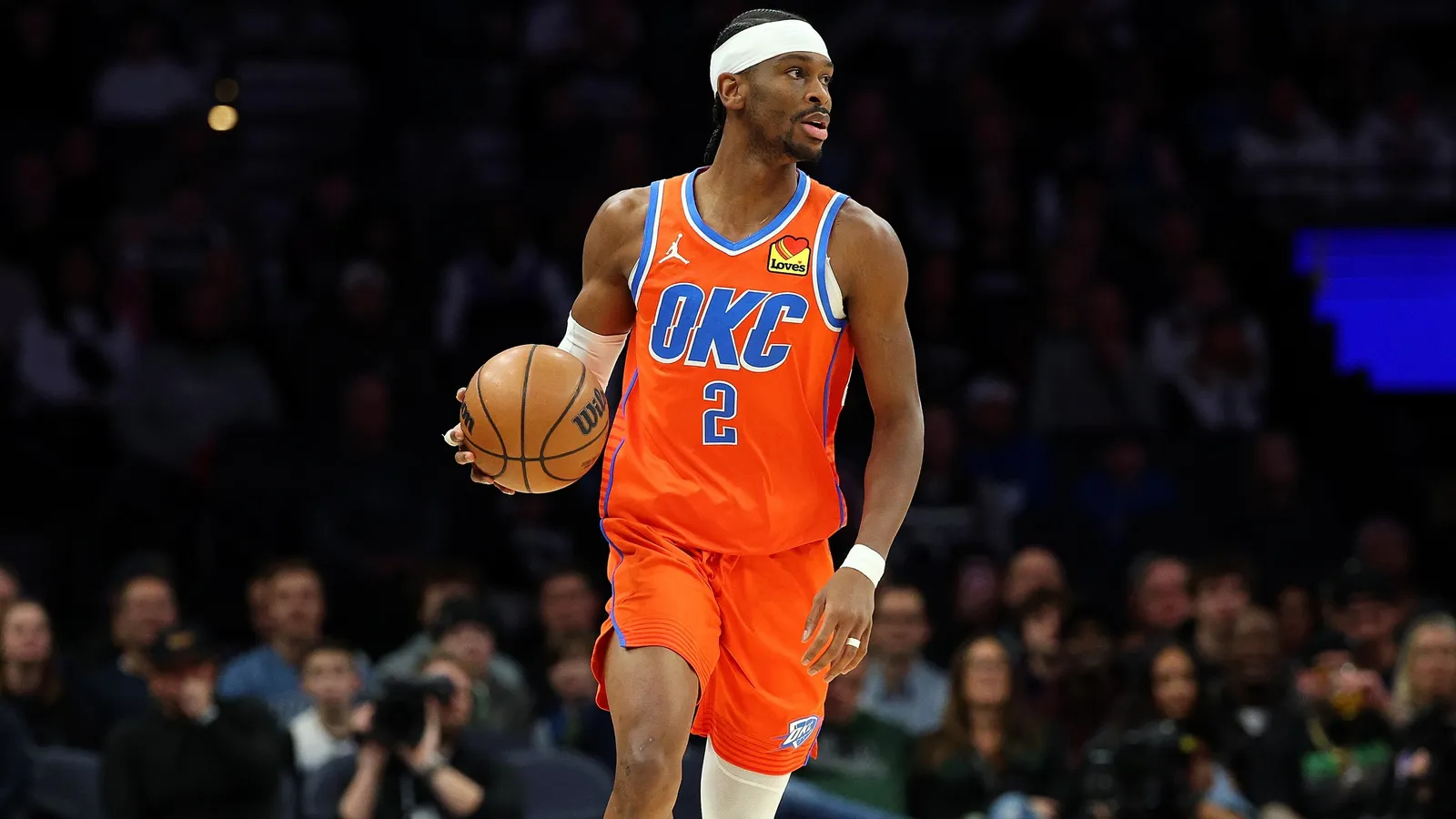 Split image showing Shai Gilgeous-Alexander in an Oklahoma City Thunder jersey on the left and Nikola Jokić in a Denver Nuggets jersey on the right, with a headline about an ESPN MVP straw poll.